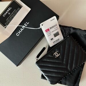 Chanel Black Chevron Quilted Lambskin Studded
O Case Wallet